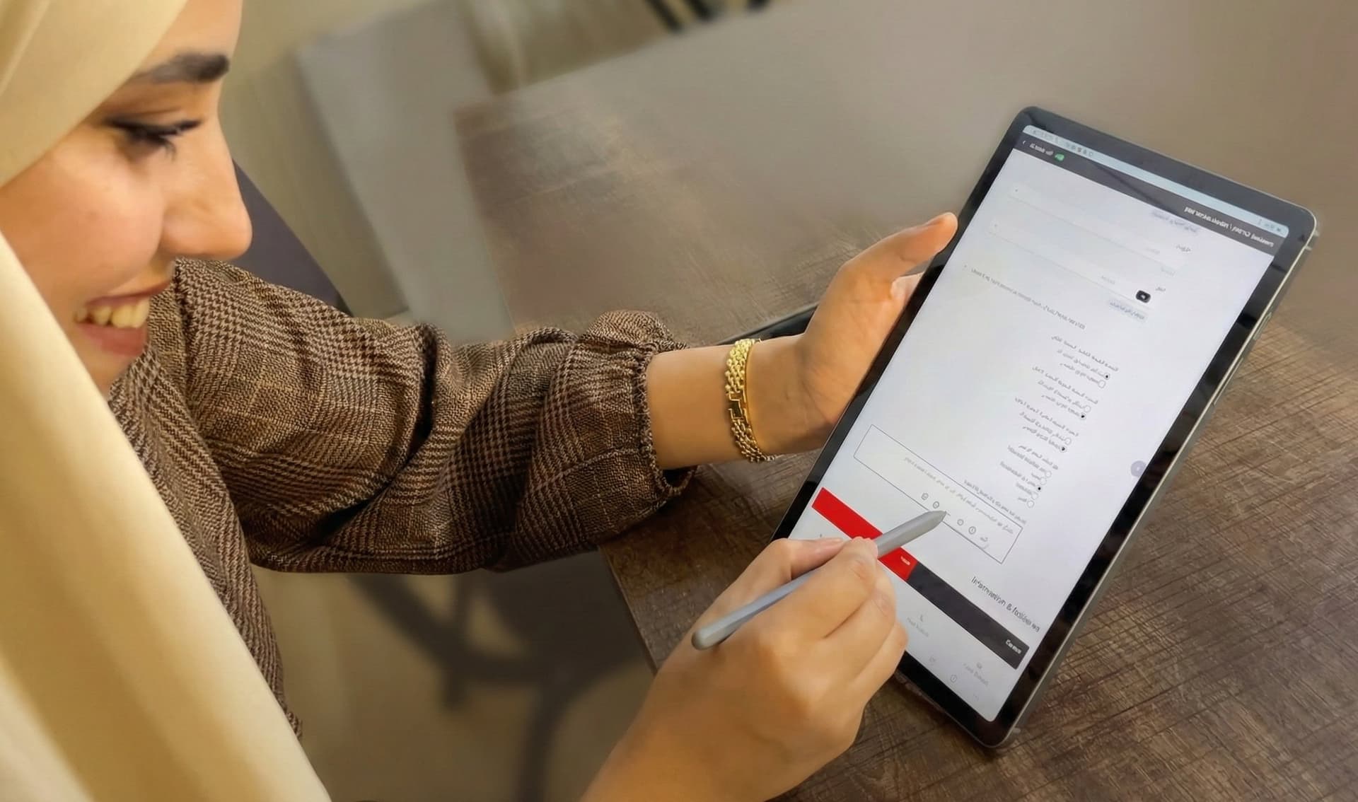 Frontline health worker entering patient data on a tablet in a humanitarian field setting